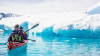 Kayak Climb Camp Basecamp Antarctica,Justin Walker Kayaking the tranquil waters in Antarctica