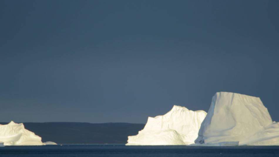 Sunset over icebergs, Syd Kap, Greenland