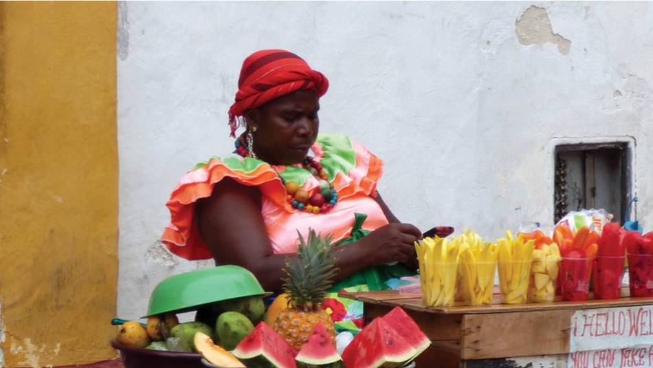 Local woman selling fresh fruits on the streets of Colombia | Pat Rochon