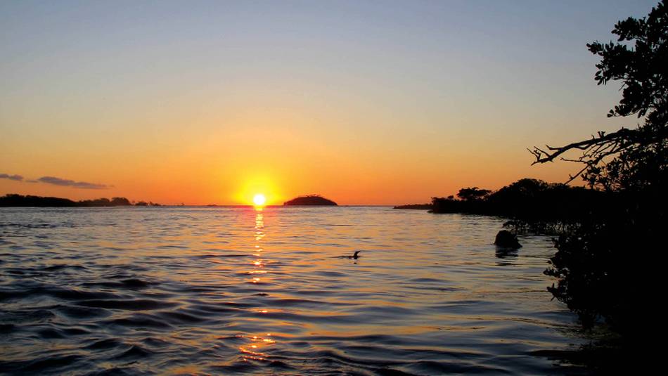 Breathtaking sunset from the beach front of Galapagos | Kate Harper