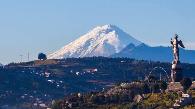 The architecturally rich city of Quito with Cotopaxi volcano in the background