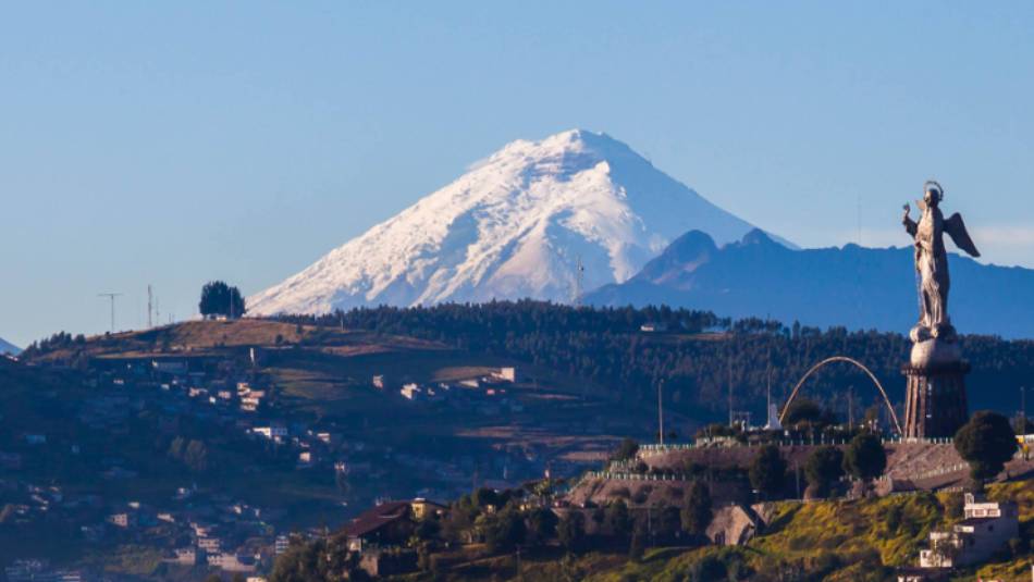 The architecturally rich city of Quito with Cotopaxi volcano in the background