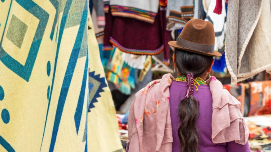 Indigenous Otavalo woman in traditional clothing at Otavalo local market