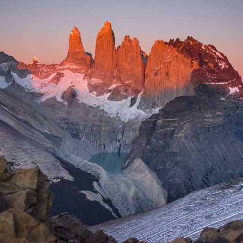 Watch the sun rise over these majestic mountains in Torres del Paine National Park, Chile