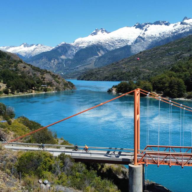 Cycling General Carrera Lake hanging bridge & northern Ice fields in the back