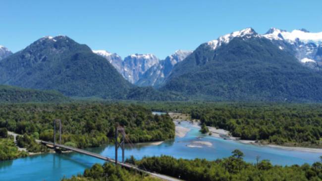 Take in the spectacular Patagonia landscape while cycling across the Yelcho suspension bridge