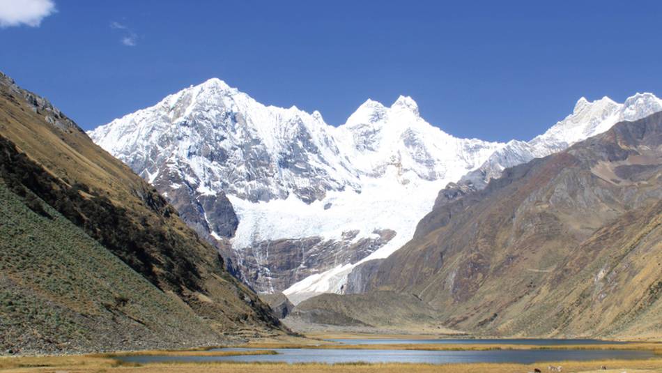 Camping amongst the rugged snowcapped peaks of Huayhuash, Peru | Ken Harris