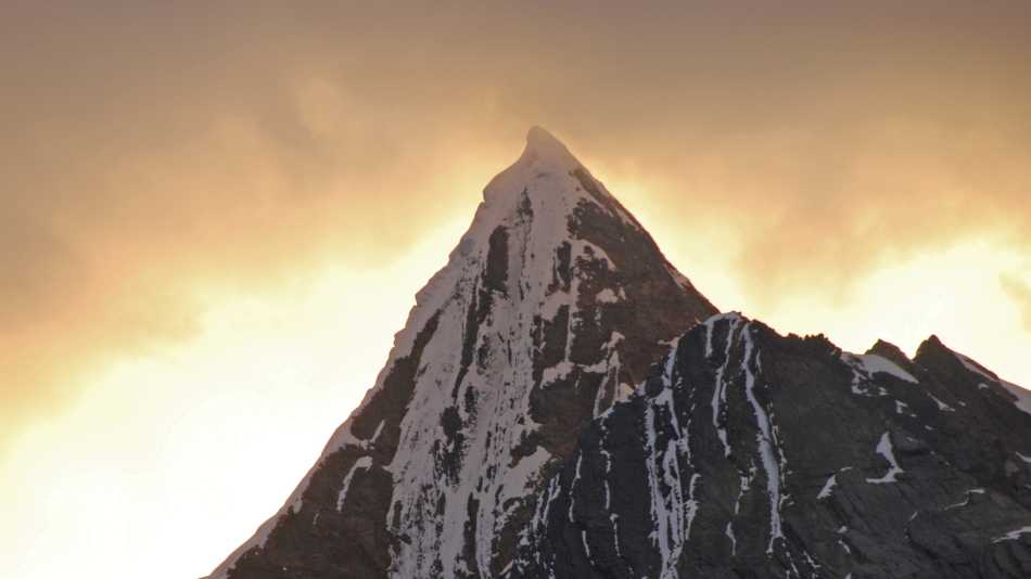 Mountain peak in view from Lake Carhuacocha, Cordillera Huayhuash, Peru. A spectacular sunset behind the peaks at camp one of the Cordillera Huayhuash. | Susan Hood