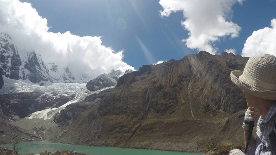 Trekker admiring the view on the Huayhuash Circuit trek | Greg Lee