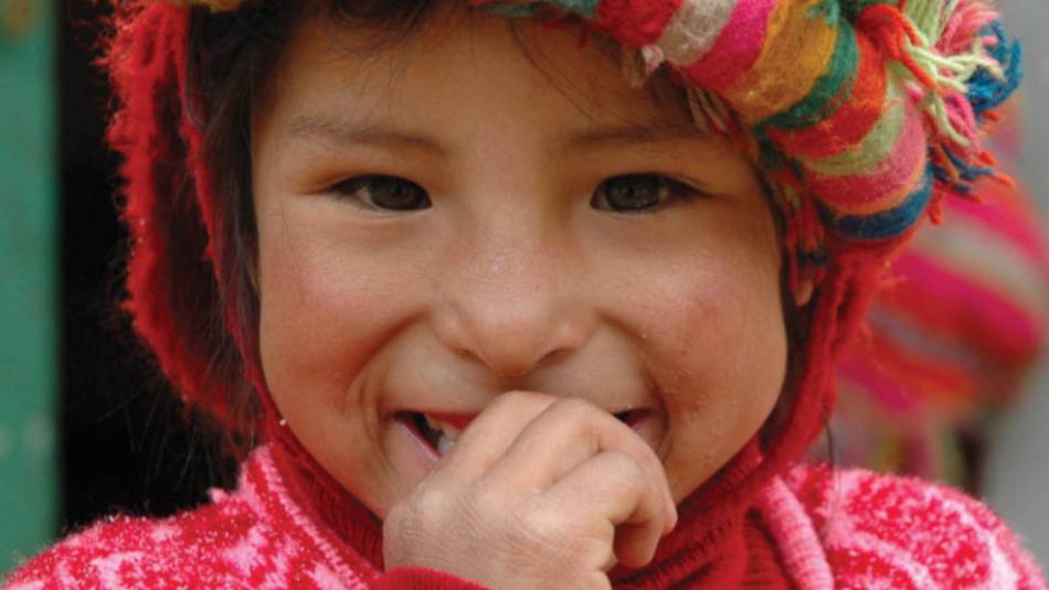 Big smiles from Quechua girl from Huilloc | Donna Lawrence