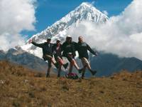 Happy trekkers enjoying the views of Salcantay, Peru |  <i>Jeanette Kuoni</i>