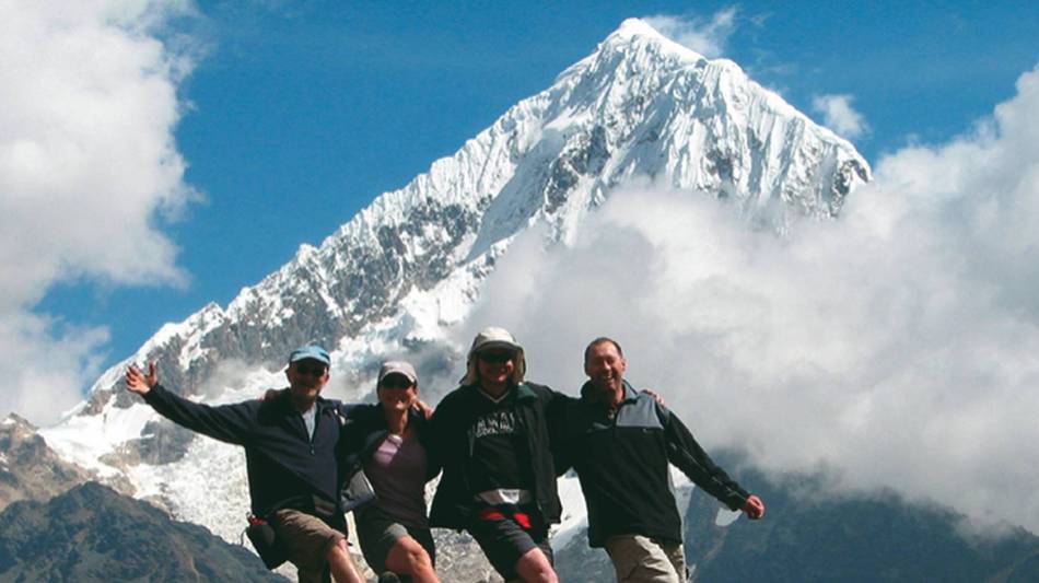 Happy trekkers enjoying the views of Salcantay, Peru | Jeanette Kuoni