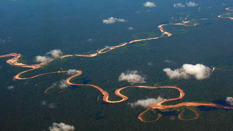 The Tambopata River winds it way through the Amazon Jungle, Peru | David Bibby