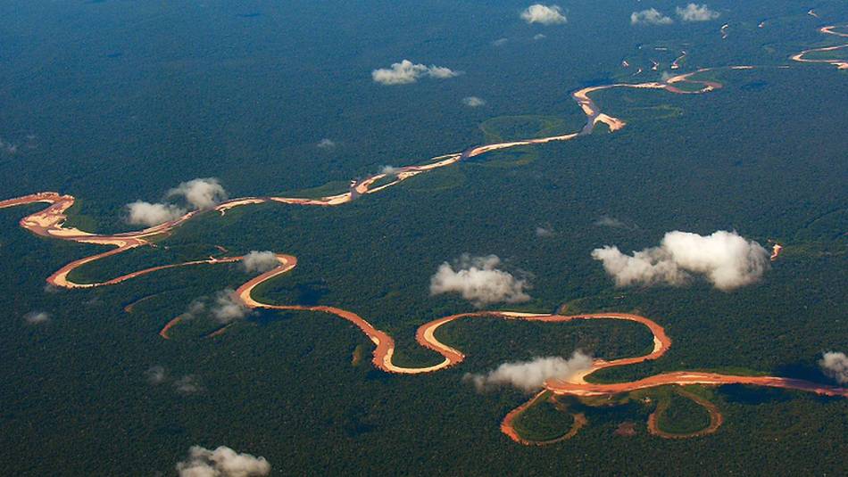 The Tambopata River winds it way through the Amazon Jungle, Peru | David Bibby