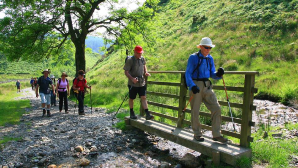 Our group crosses a stream on Wainwright's Coast to Coast walk | John Millen