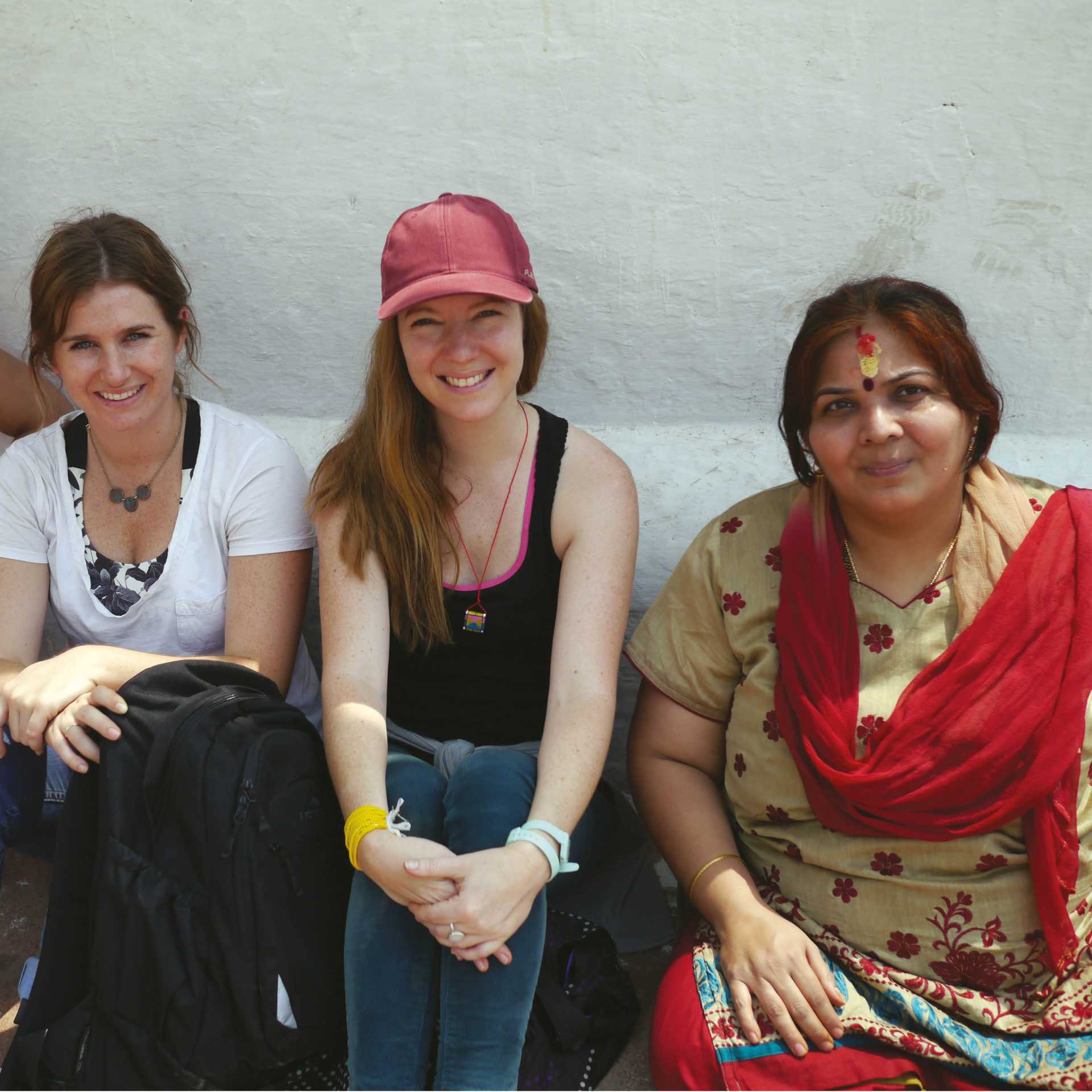 Trekkers sitting with some locals | Sally Imber