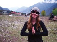 Happy trekker giving thanks for a great trip |  <i>Sally Imber</i>