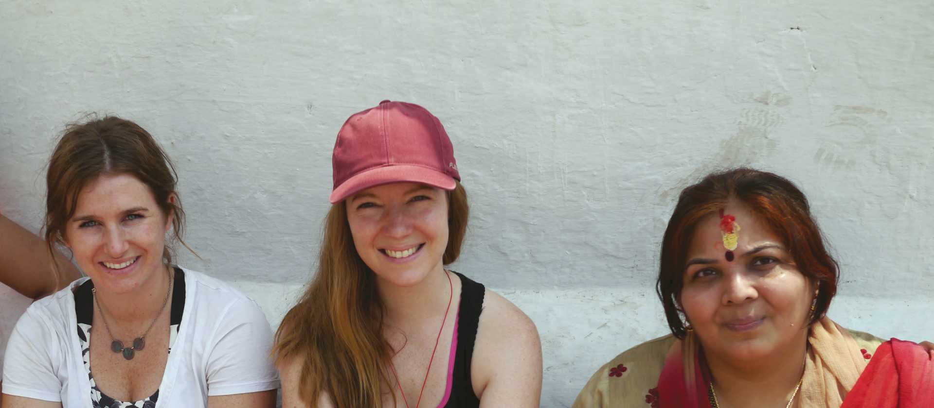 Trekkers sitting with some locals | Sally Imber