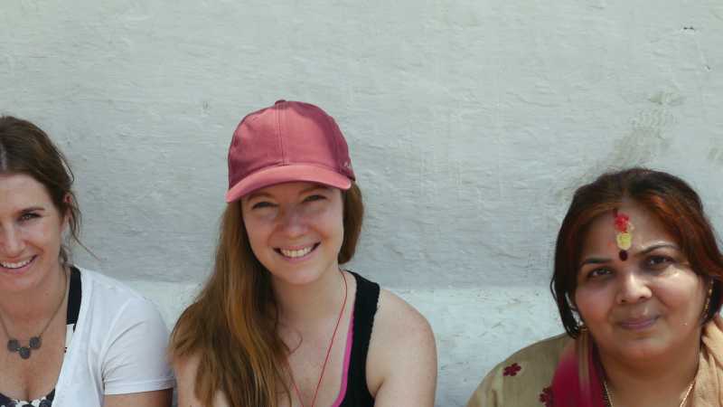 Trekkers sitting with some locals | Sally Imber