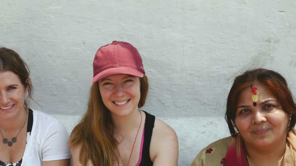 Trekkers sitting with some locals | Sally Imber