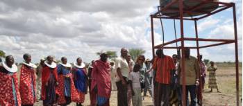 The Masai people gather to celebrate the newly installed water tank in their Kakoi village, Tanzania | Kylie Turner 