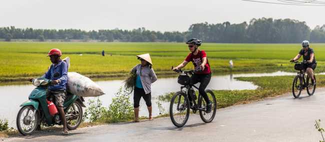 Passing locals near Chau Doc in the Mekong Delta | Lachlan Gardiner
