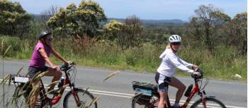 Cyclists on a quiet road in the Southern Highlands | Kate Baker