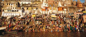 Indian pilgrams bathing in the holy Ganges river at Varanasi. | David Lazar