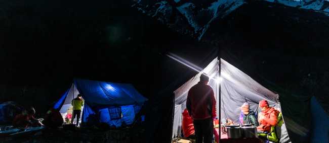 Relaxing in the mess tent while on a remote trek in Nepal | Lachlan Gardiner